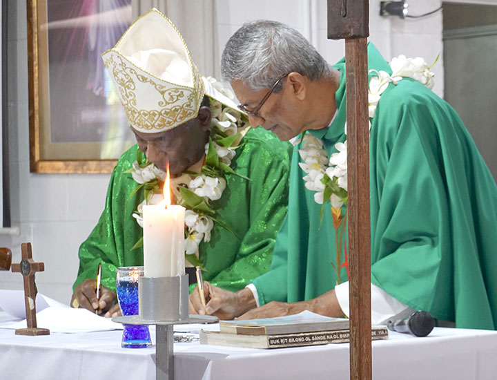 1-Mass-13-signing-of-the-Profession-of-Faith.jpg
